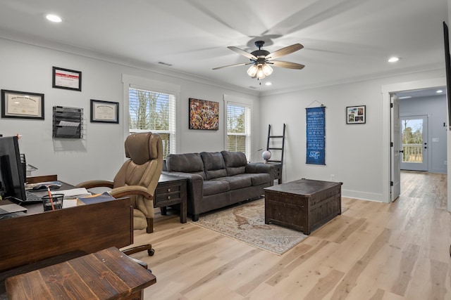 home office featuring crown molding, ceiling fan, and light hardwood / wood-style floors