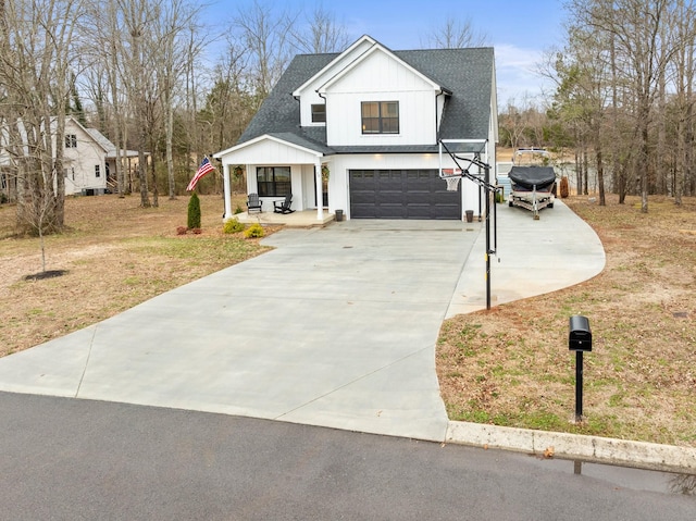 modern farmhouse style home featuring a garage, a front yard, and a porch