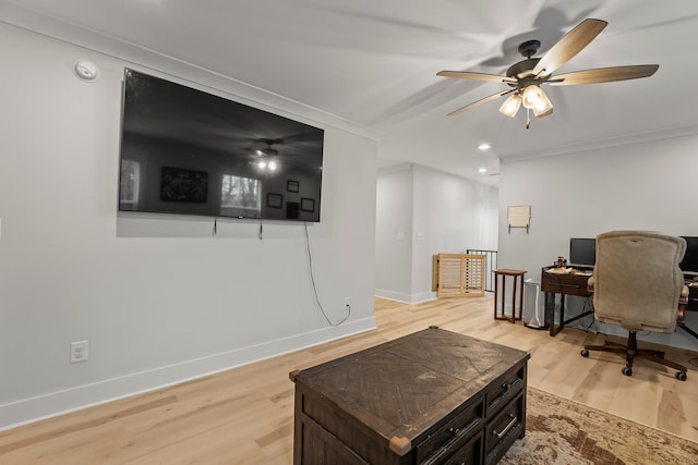 home office with ceiling fan, crown molding, and light hardwood / wood-style floors