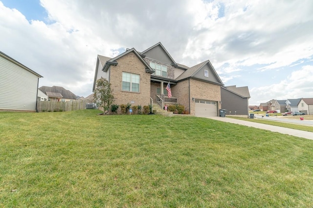 view of front of property with a garage and a front lawn