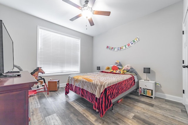 bedroom with hardwood / wood-style flooring and ceiling fan