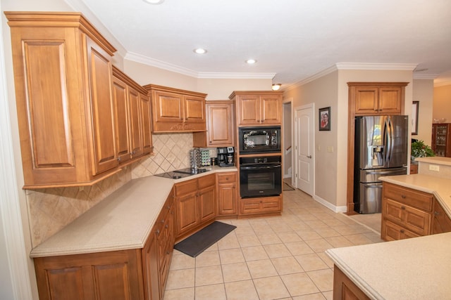 kitchen featuring light tile patterned floors, decorative backsplash, ornamental molding, and black appliances