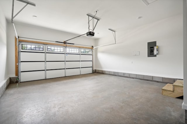 garage with electric panel and a garage door opener