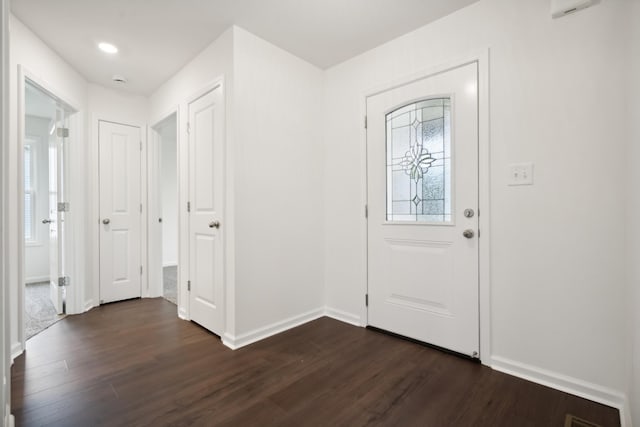 entrance foyer with dark hardwood / wood-style floors