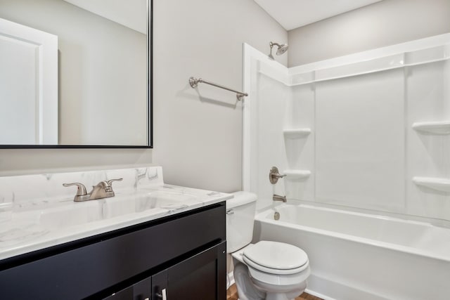 full bathroom featuring vanity, shower / washtub combination, and toilet