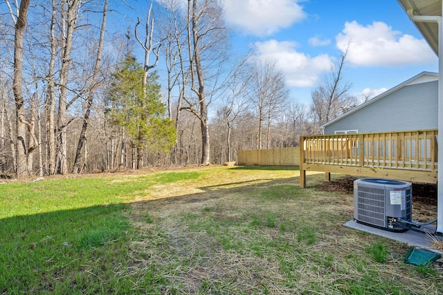 view of yard with cooling unit and a wooden deck