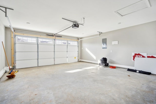 garage with a garage door opener and electric panel