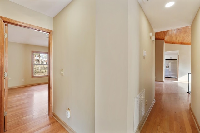 hall with light hardwood / wood-style flooring