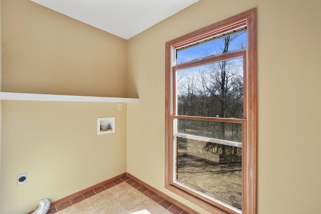 laundry area featuring washer hookup, hookup for an electric dryer, and light tile patterned floors