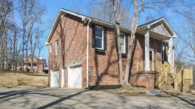 view of side of property with a garage