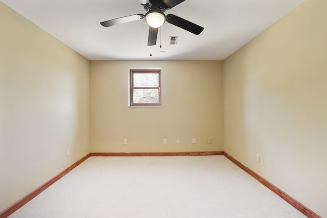 carpeted empty room with ceiling fan