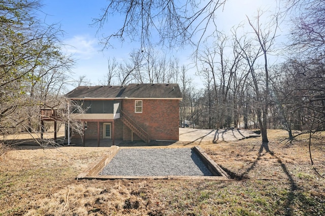 rear view of house with a deck