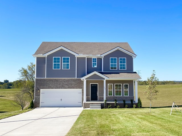 view of front of property featuring a garage and a front yard