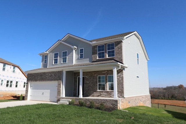 view of front facade featuring a garage, a porch, and a front yard