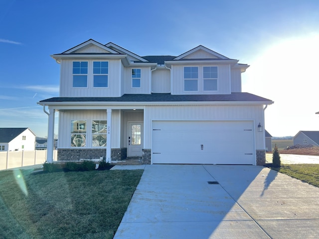 craftsman-style house with a garage and a front yard