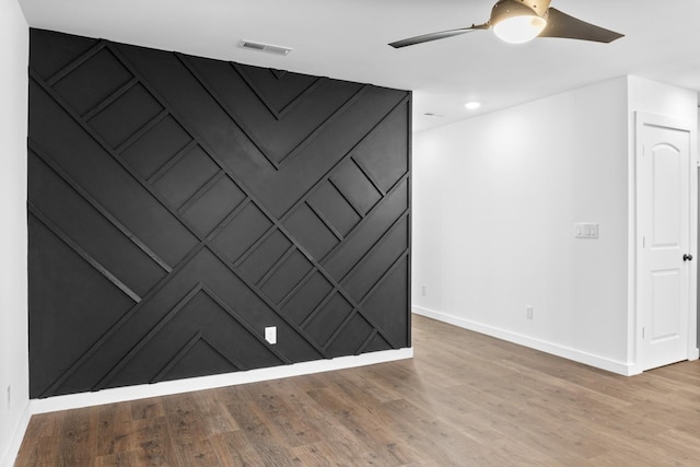 unfurnished room featuring wood-type flooring and ceiling fan