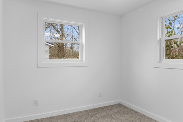 unfurnished room featuring carpet flooring