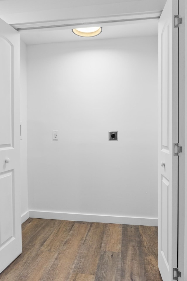 laundry area featuring dark hardwood / wood-style floors and hookup for an electric dryer