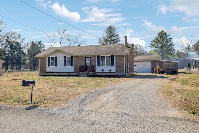 ranch-style home with a garage and a front lawn