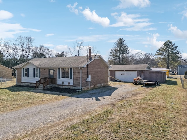 single story home featuring a garage and a front yard