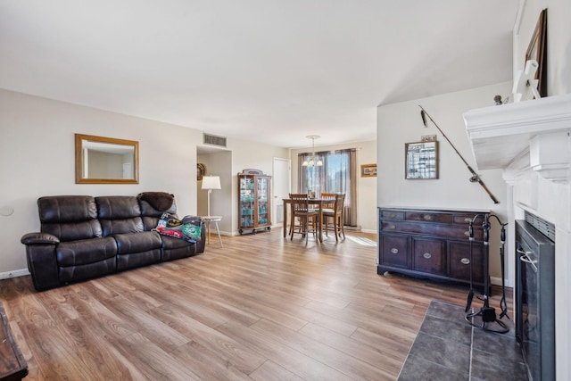 living room with wine cooler and wood-type flooring