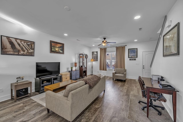 living room featuring hardwood / wood-style flooring and ceiling fan