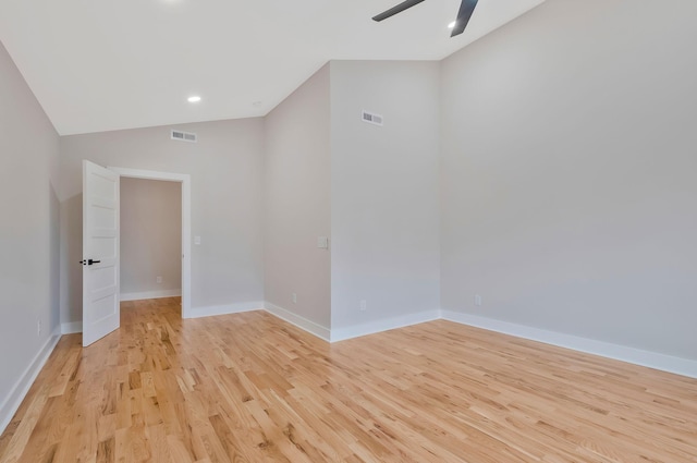 unfurnished room featuring vaulted ceiling, ceiling fan, and light wood-type flooring