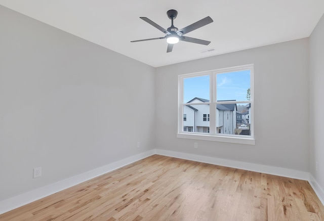 unfurnished room featuring ceiling fan and light wood-type flooring