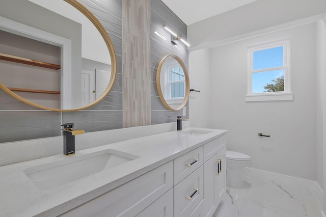 bathroom with vanity and toilet