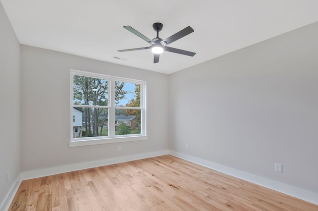 empty room featuring ceiling fan and light wood-type flooring