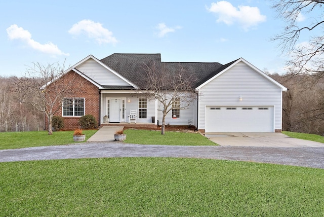 view of front of house with a garage and a front yard