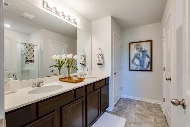 bathroom with vanity and a shower