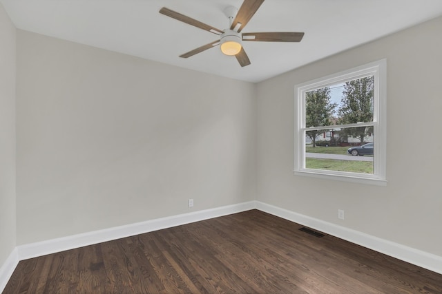 spare room featuring wood-type flooring and ceiling fan