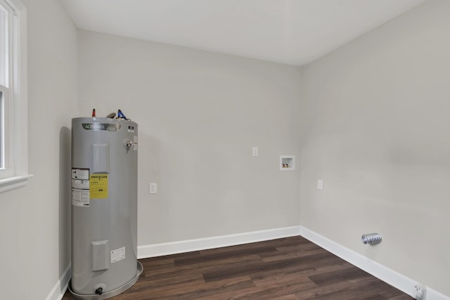 washroom featuring dark hardwood / wood-style flooring, hookup for a washing machine, and water heater