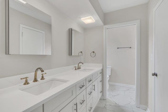 bathroom with vanity and toilet