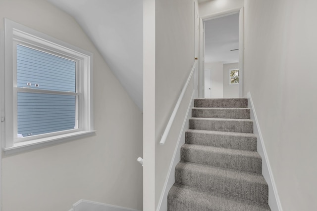 stairway with lofted ceiling