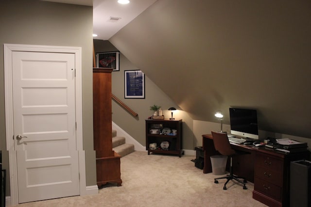 home office featuring vaulted ceiling and light carpet