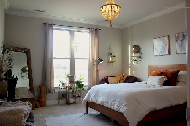 bedroom featuring ornamental molding, carpet floors, and a notable chandelier