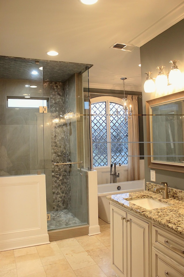 bathroom with vanity and separate shower and tub