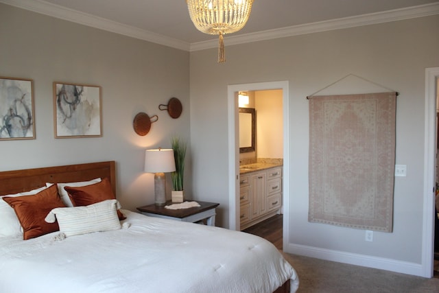 carpeted bedroom with ornamental molding, connected bathroom, and an inviting chandelier