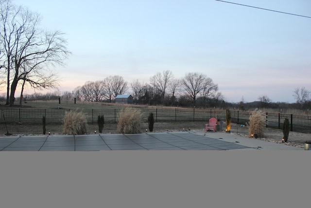 view of yard at dusk