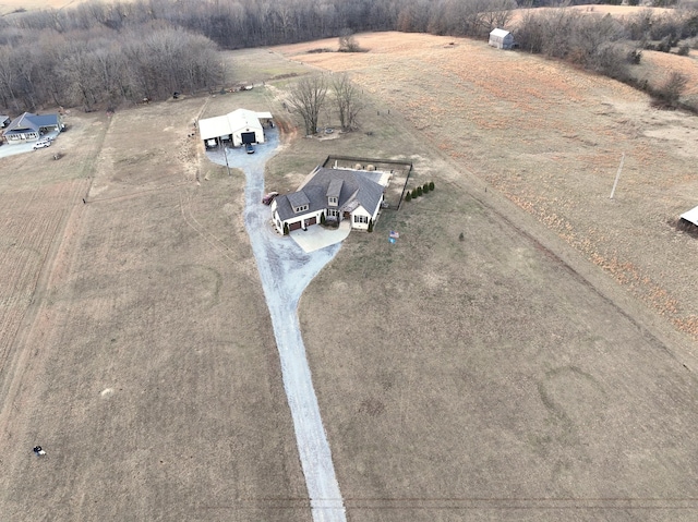 birds eye view of property with a rural view