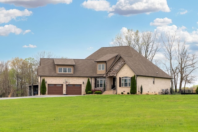 4888 Rock House Rd, Portland, TN 37148 - view of front of home featuring a front lawn, a garage, driveway, and roof with shingles