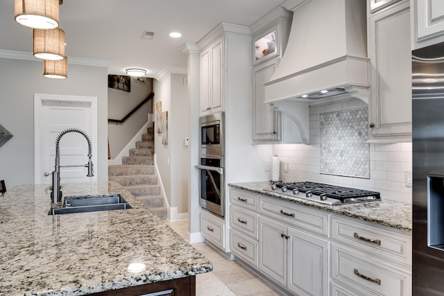 4888 Rock House Rd, Portland, TN 37148 - kitchen with custom exhaust hood, built in appliances, ornamental molding, visible vents, and a sink