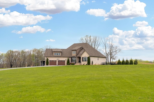 4888 Rock House Rd, Portland, TN 37148 - view of front of house featuring a garage, driveway, and a front lawn
