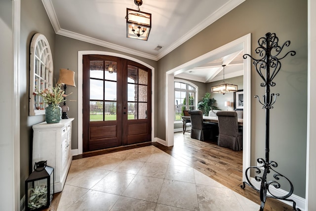 4888 Rock House Rd, Portland, TN 37148 - entrance foyer with baseboards, ornamental molding, french doors, arched walkways, and wood finished floors