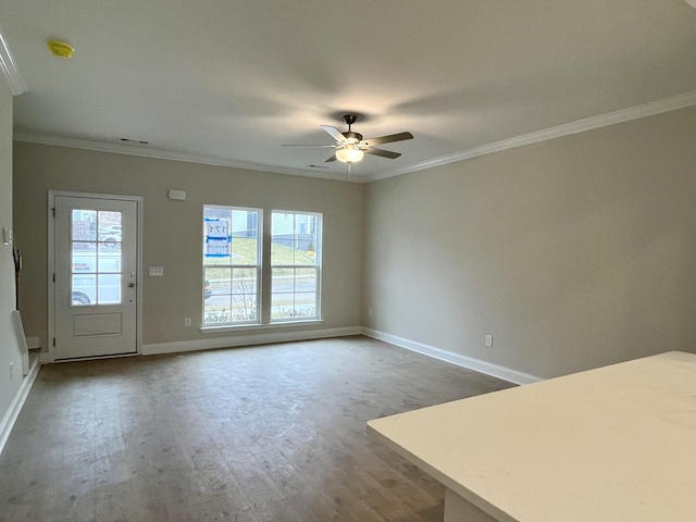 unfurnished living room featuring crown molding, ceiling fan, and hardwood / wood-style flooring