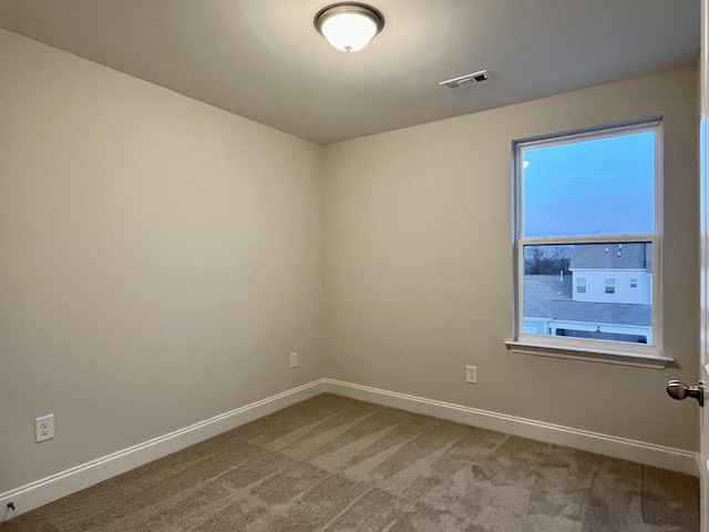 empty room featuring carpet floors