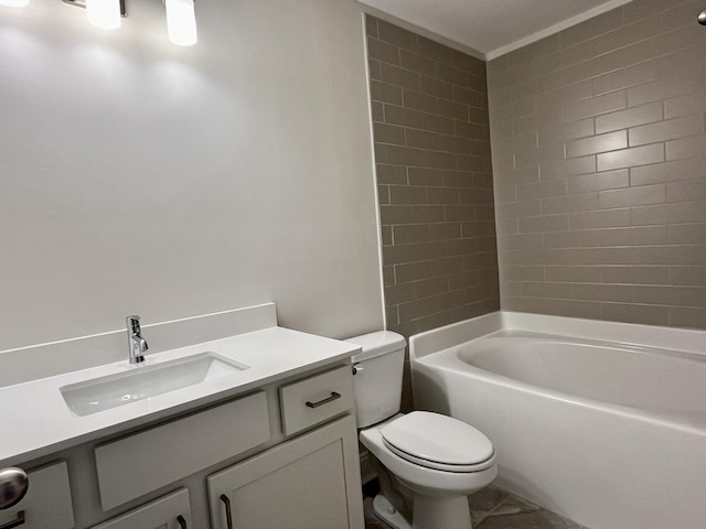 full bathroom with tiled shower / bath, vanity, and toilet