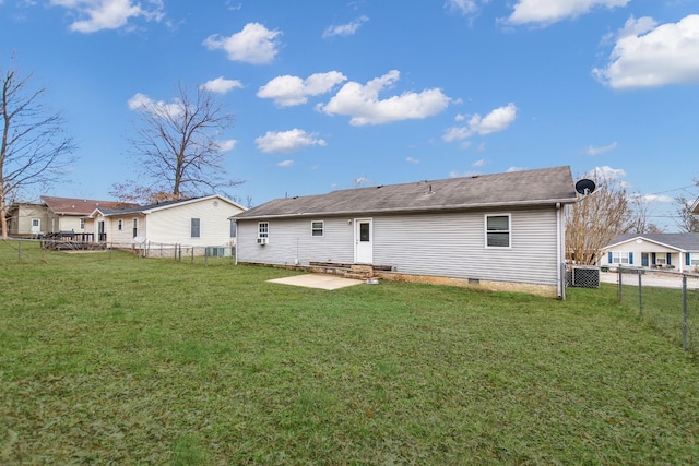 back of house with a yard and a patio area